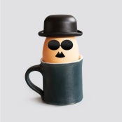 Hipster breakfast egg characters with mustache, beard, black bowler hat and glasses. Creative design holiday poster eggs cups. drawn gentleman faces vintage style. gray background.